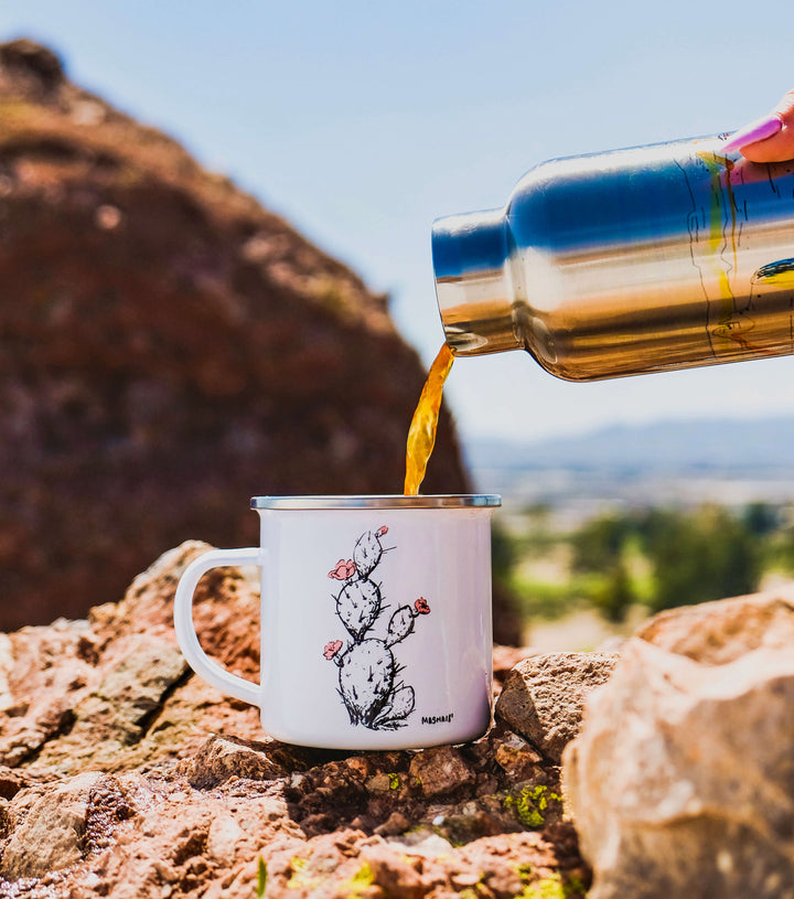https://www.couloirart.com/cdn/shop/files/Prickly_pear_camp_mug_in_the_desert_with_insulated_custom_printed_water_bottle_with_bamboo_lid_c09024b5-bf2e-43d8-a672-16bc722cf1eb_720x.jpg?v=1637191359